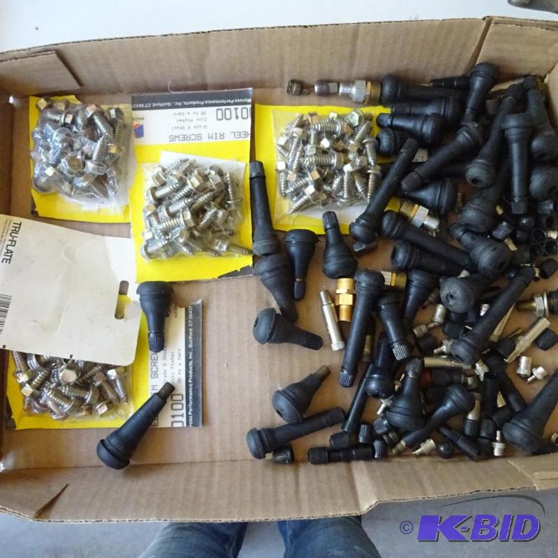 lot 224 image: Wheel Rim Screws and Tire Valve Stems...