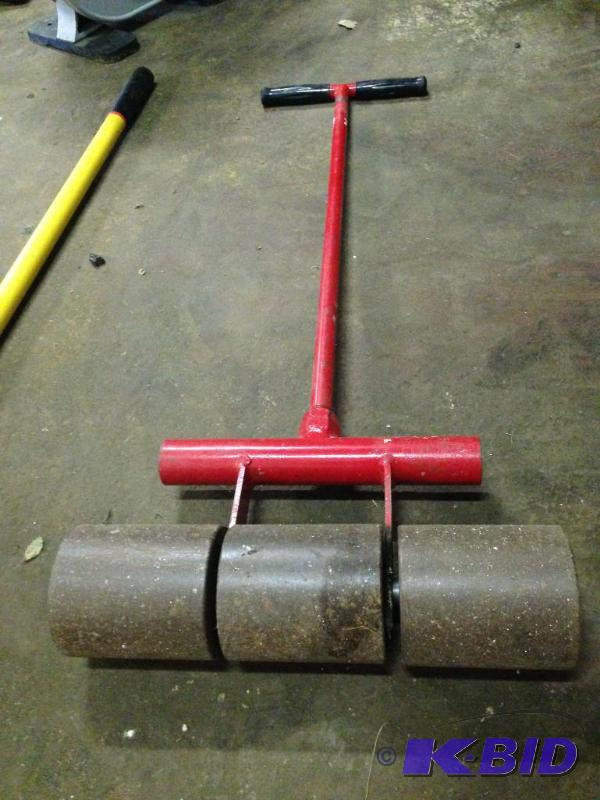 lot 13 image: 80 Pound Floor Roller Red...