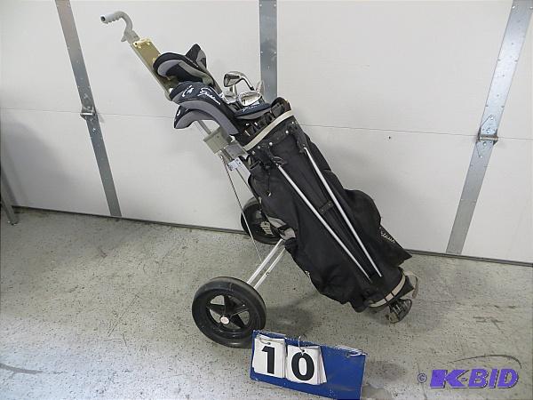 lot 10 image: Nicklaus Gold Clubs with case and cart. 13 cl...