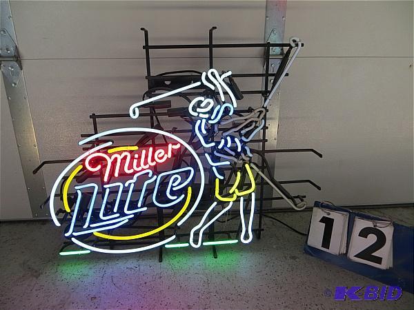 lot 12 image: Miller Light Golf Neon. Golf club swings moti...