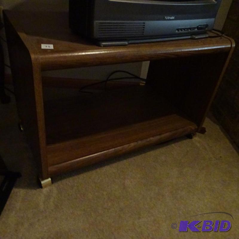 lot 75 image: TV stand on wheels. Laminate. 29x18x20...