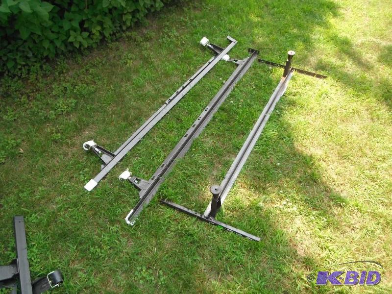 lot 107 image: King size metal bed frame with wheels...