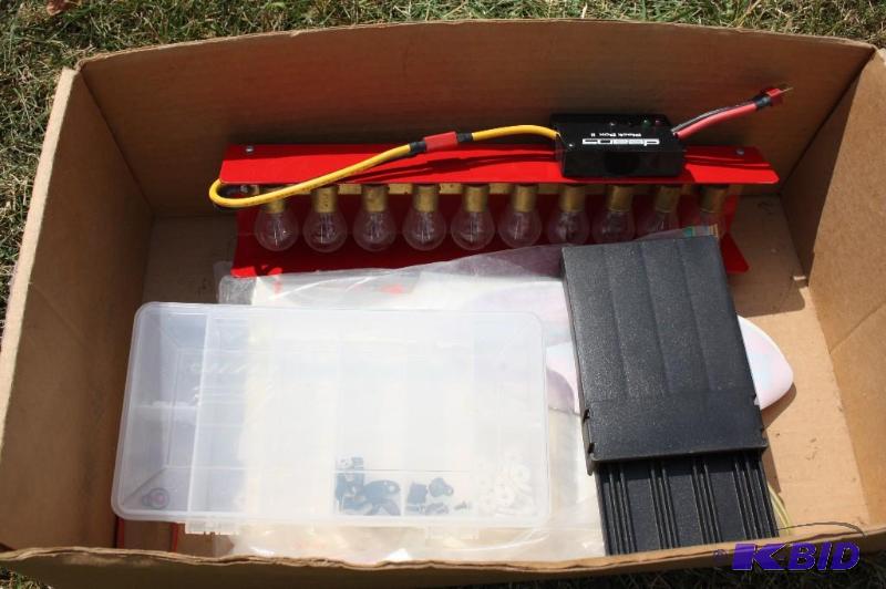 lot 264 image: RC car decals and battery discharger...