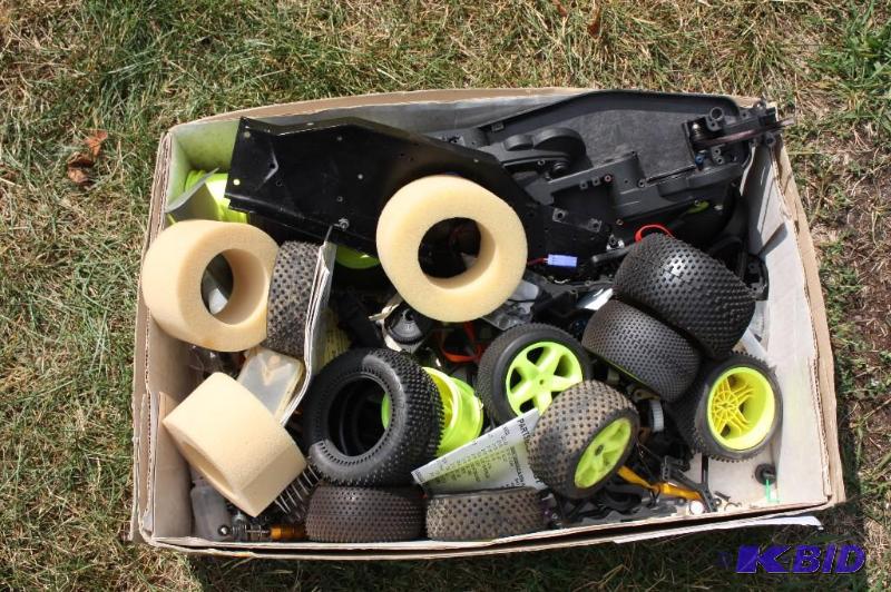 lot 269 image: Box full of RC bodies, tires, miscellaneous p...