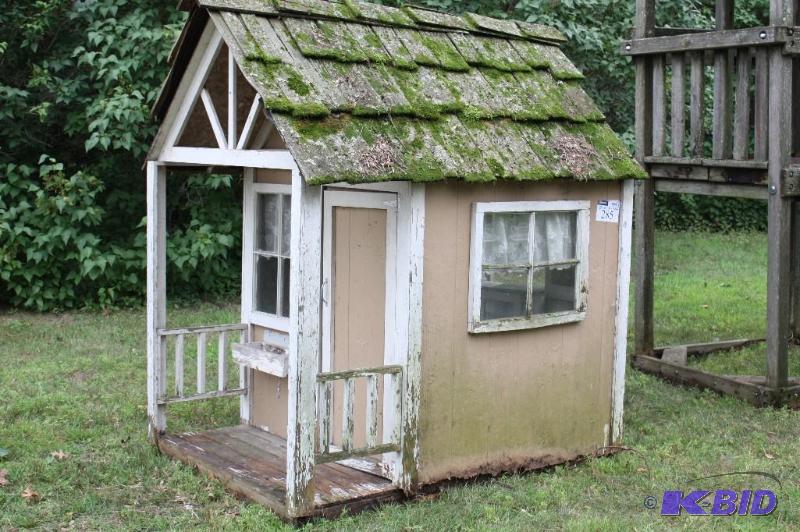 lot 285 image: Wooden playhouse with windows and cabinets 68...