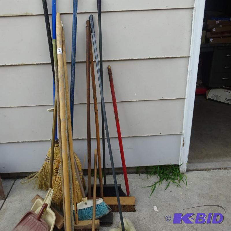 lot 282 image: Pile of Brooms and Wood Handles...