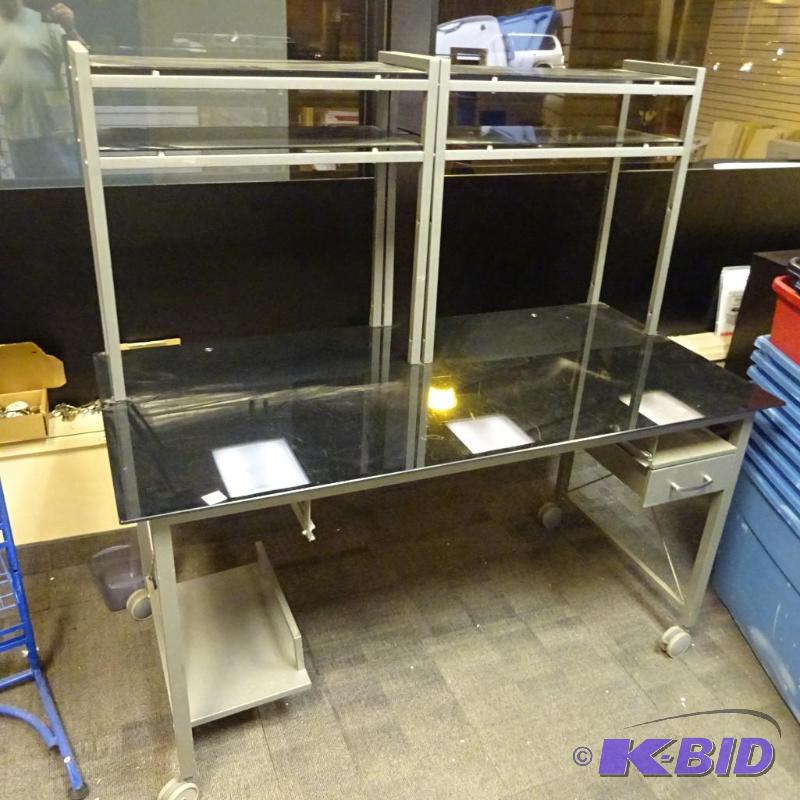 lot 245 image: Glass surface desk with metal frame. One draw...