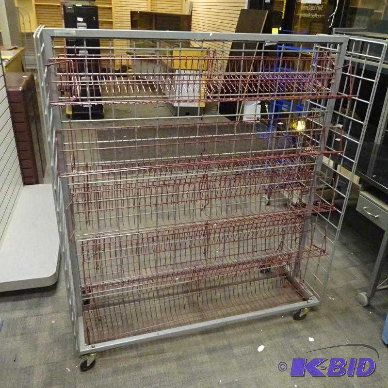 lot 251 image: Metal VHS or DVD rack on wheels. 51 x 18 x 56...