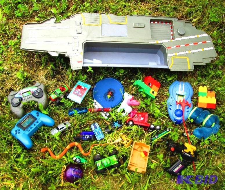 lot 102 image: Cargo ship and other assorted toys...