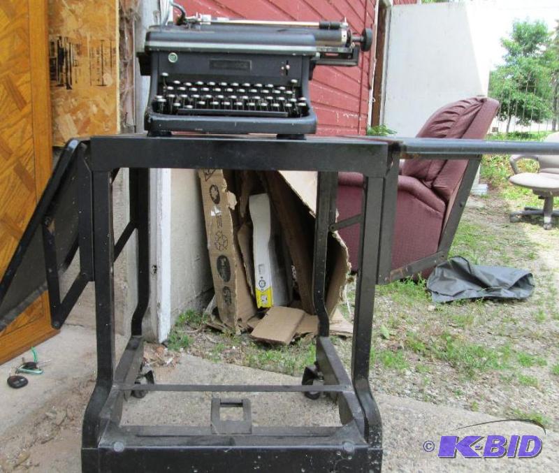 lot 11 image: Antique typewriter on metal wheeled stand...