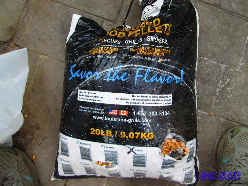 lot 129 image: damaged bag of flavored wood pelets for grill...