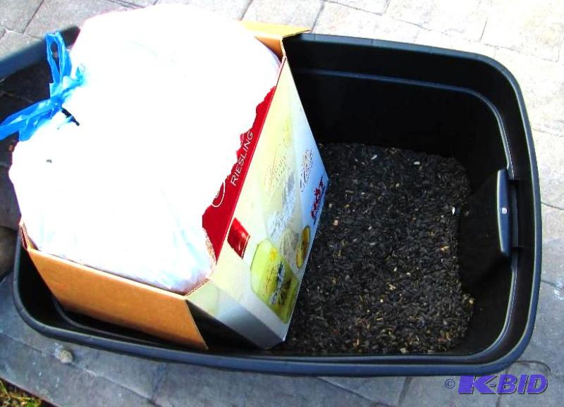 lot 131 image: half tub and large bag of black ouf balck oil...