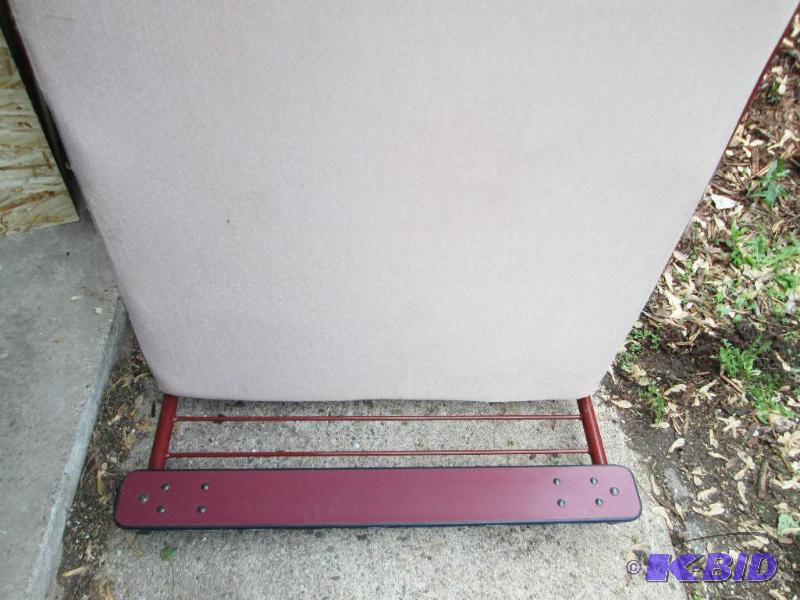 lot 398 image: Twin size bed, padded. Stands vertical and is...