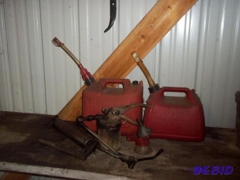 lot 104 image: 2 Plastic Gas Cans    2 screw guns   3 small funnels