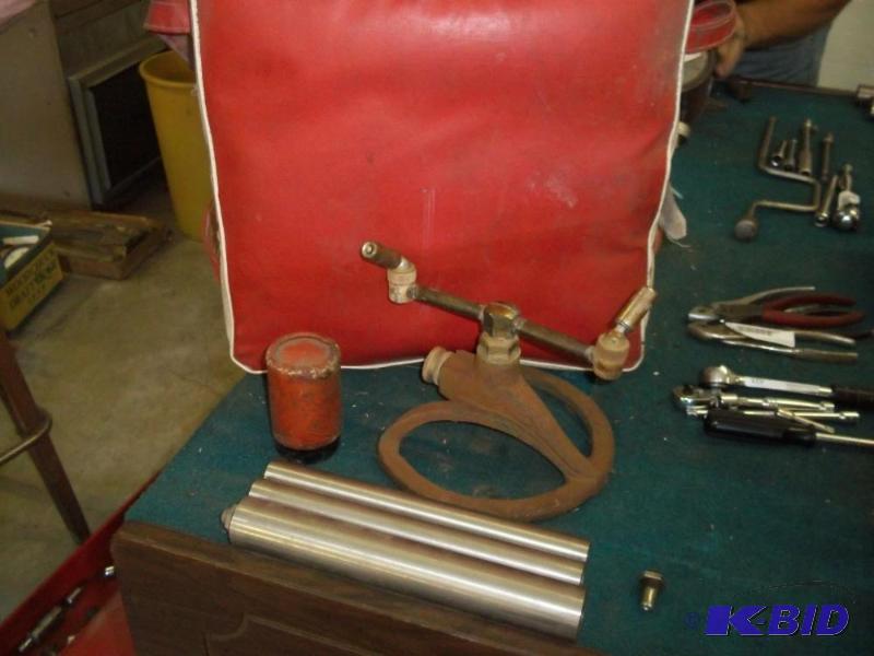 lot 446 image: Vintage sprinkler, boat cushion and 3 rollers
