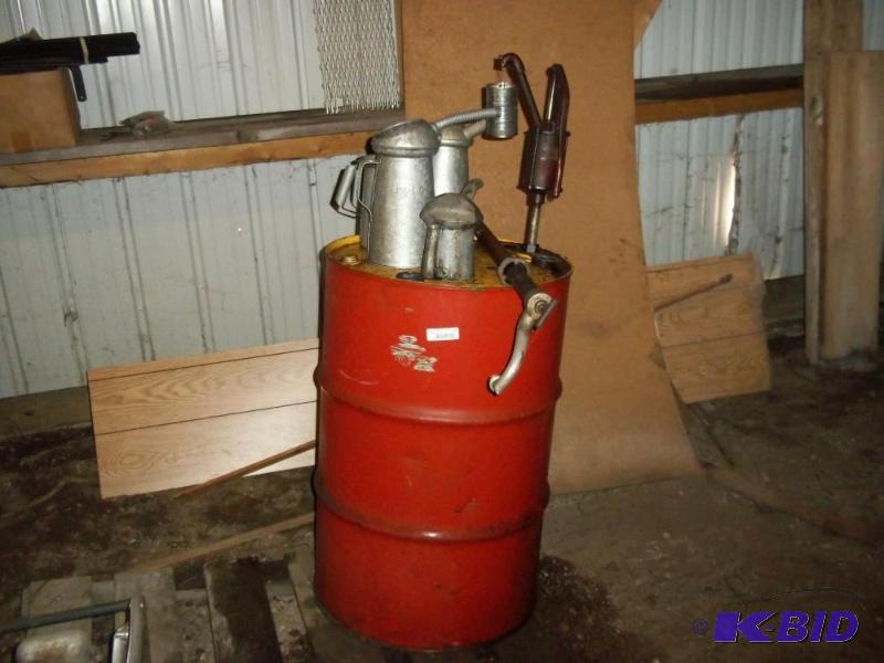 lot 70 image: 55 gal oil barrel drum third full includes 2 pumps and 4 oil cans