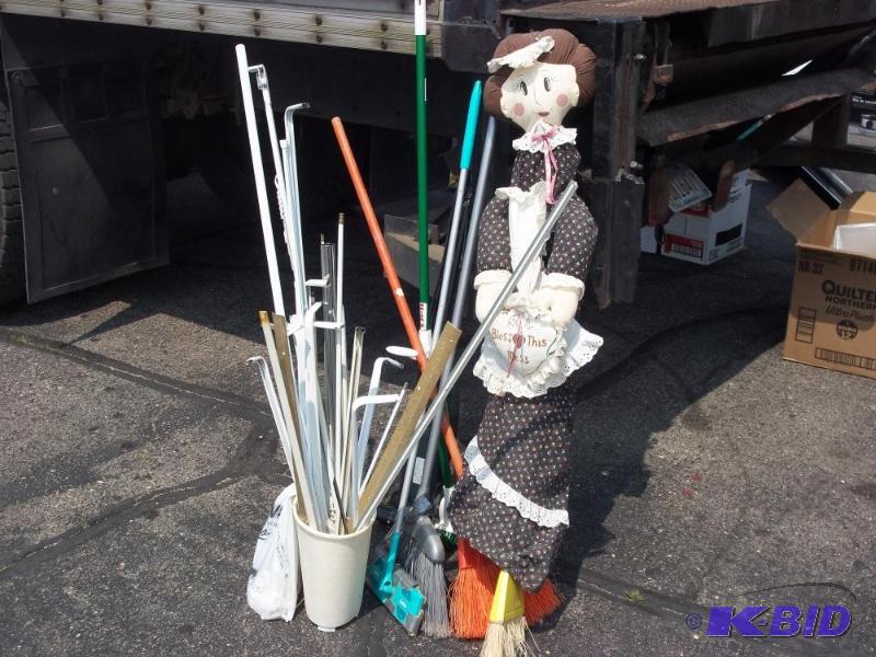 lot 220 image: Cleaning supplies with curtain rods