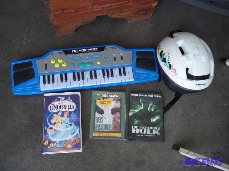 lot 232 image: Toy Piano, bike helmet and movies