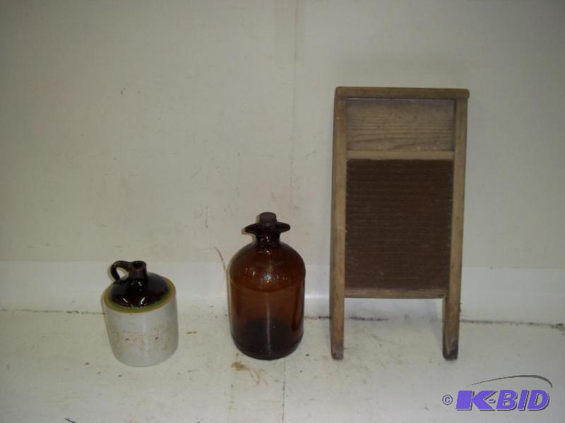 lot 27 image: Washboard and 2 glass jugs