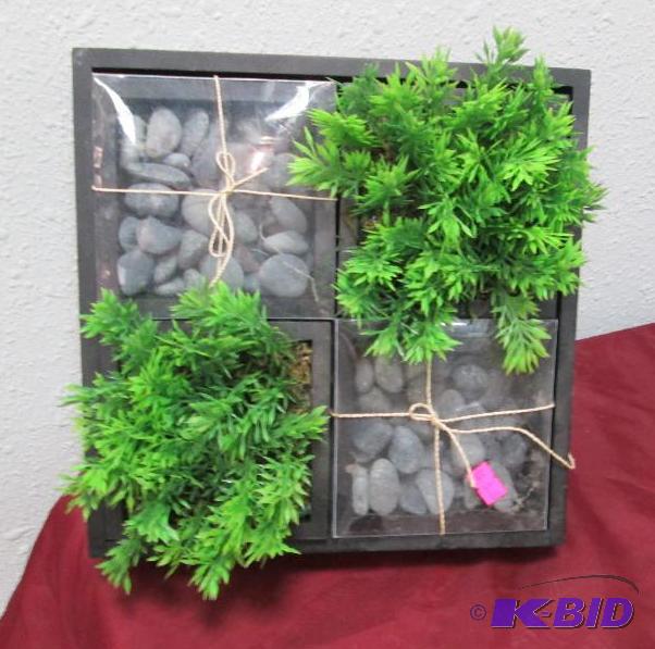 A square container inside there is a 2 plants...