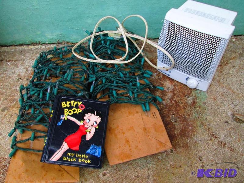 lot 125 image: Heater, holiday lights and Betty Boop tin hol...