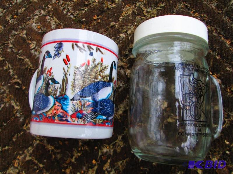 lot 130 image: Pair of mugs, one with a coin slot top...