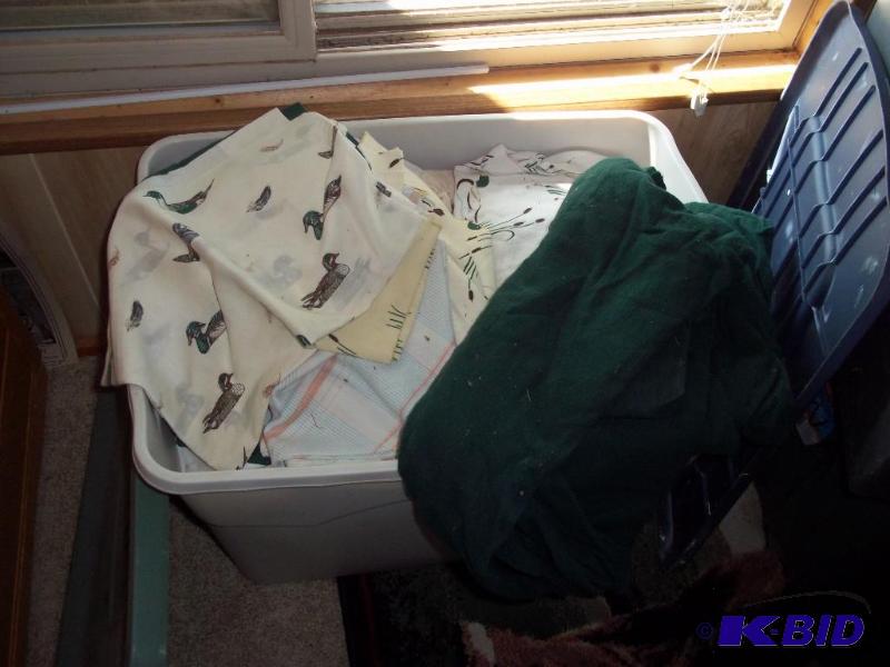 Storage tub of Duck sheets and misc bedding