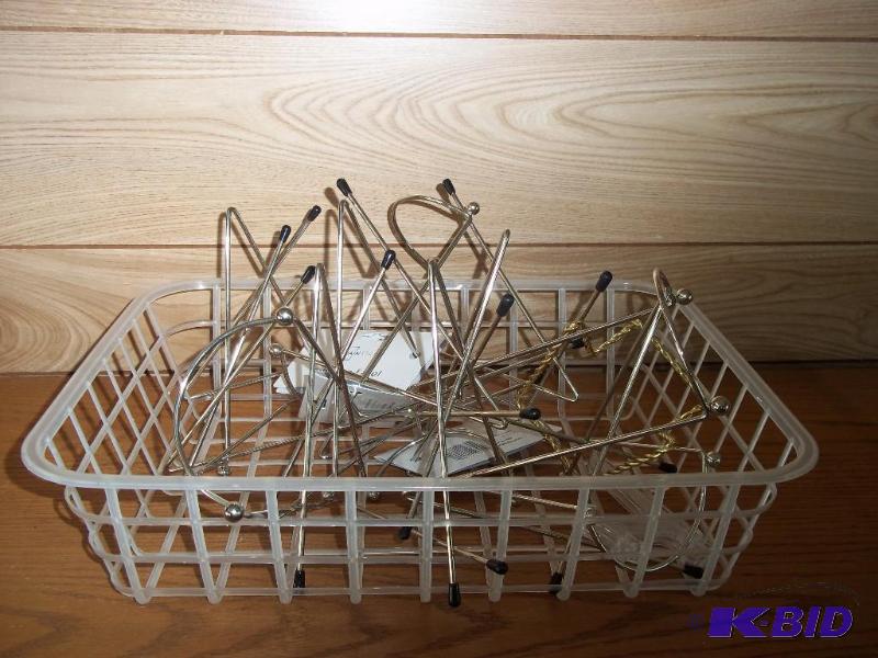 assortment of plate holders and easles