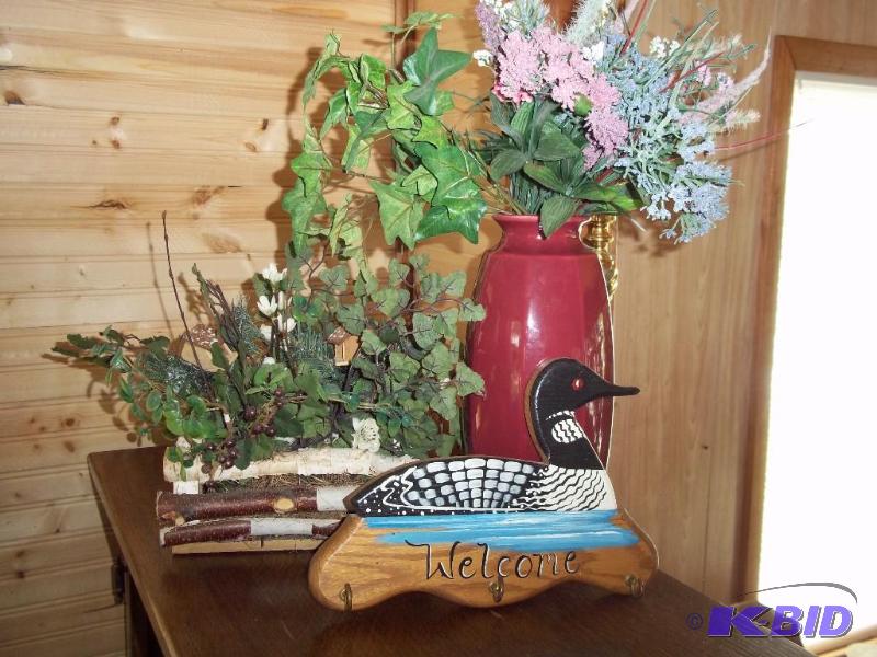 Maroon vase, loon wall dcor, stick basket with plant dcor