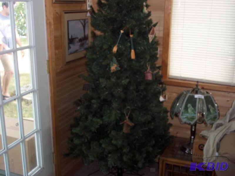 Christmas tree with woodland ornaments and lights