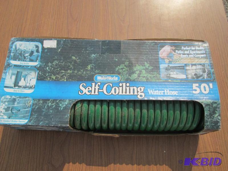 lot 1 image: Water Works 50 foot self coiling garden hose,...