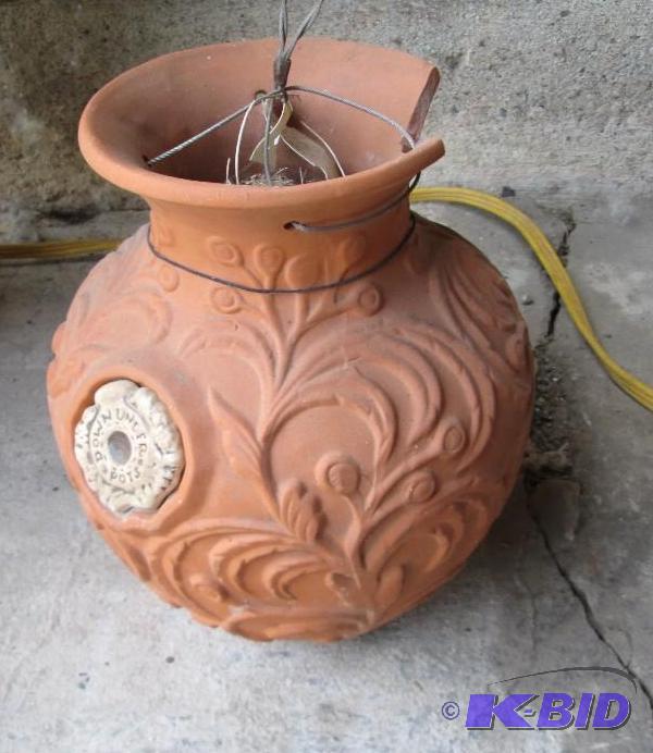 lot 101 image: Terra cotta hanging planter, has a piece chip...
