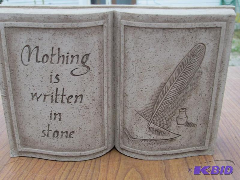 lot 158 image: Cast book shape with saying nothing is writt...
