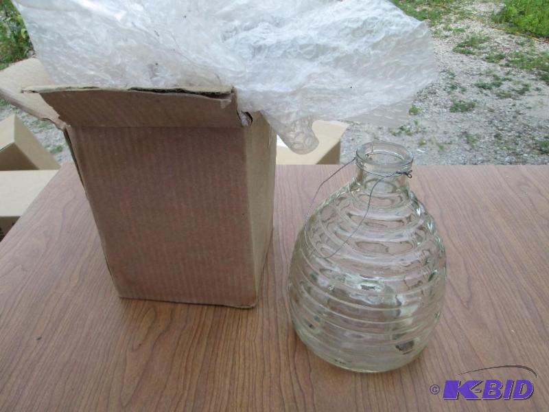 lot 176 image: Hanging glass bottle, with feet, opening in b...
