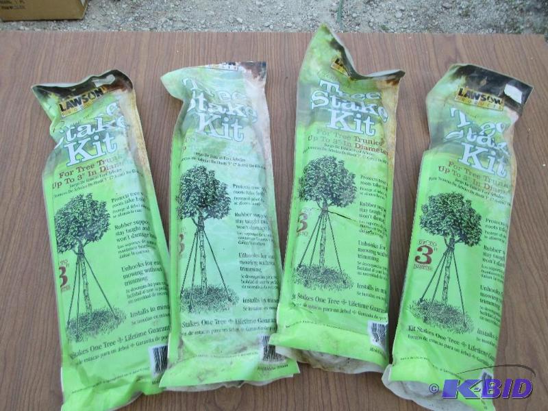 lot 192 image: Lot of 4 tree stake kits, rubber supports, un...