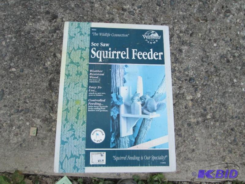 lot 197 image: See saw squirrel feeder, corn cob holder...