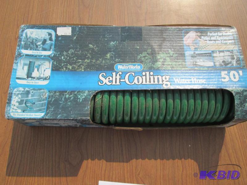lot 3 image: Water Works 50 foot self coiling garden hose,...