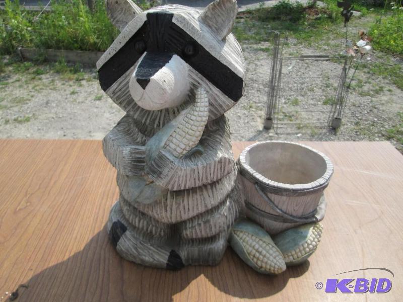 lot 30 image: Racoon next to a small planter, racoon is 12 ...