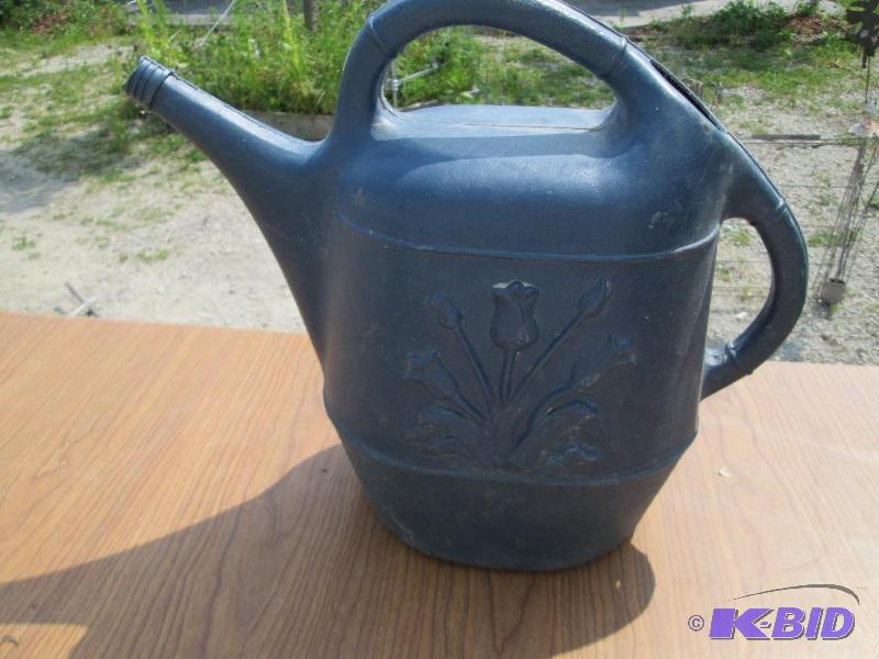 lot 36 image: Plastic watering can, approx 2 gallon...