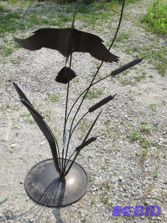 lot 38 image: All metal coated bird shilouette with cattail...