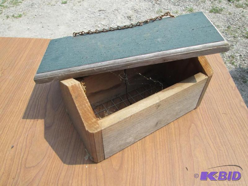 lot 53 image: Wood bird feeder, all enclosedto keep dry and...