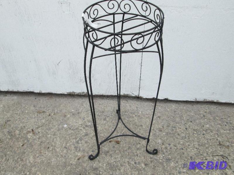 lot 98 image: Metal planter holder, 10 inches across, 29 in...