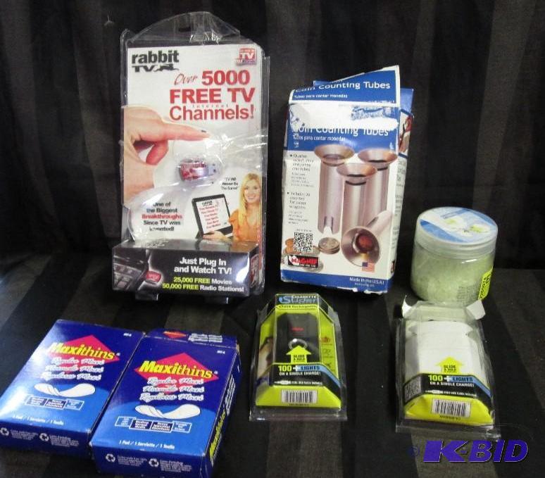 rabbit tv, coins counting cups, maxipads, cig...