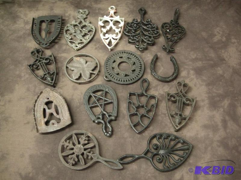 lot 123 image: Large group cast iron trivets