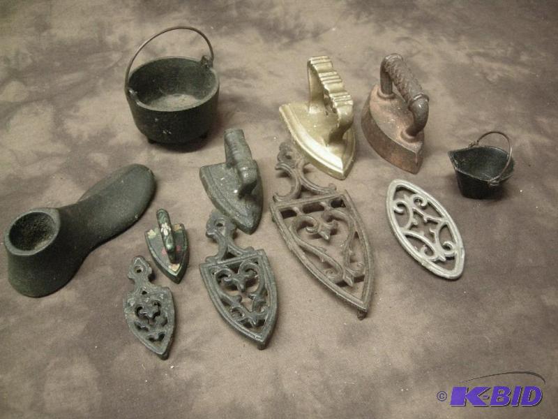 lot 127 image: Group of cast iron mini irons and more