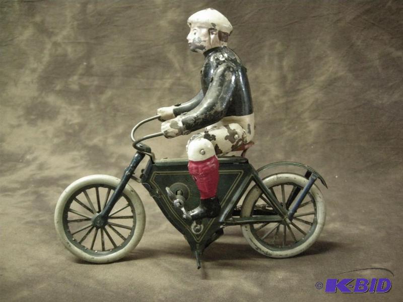 lot 13 image: Early tin windup toy