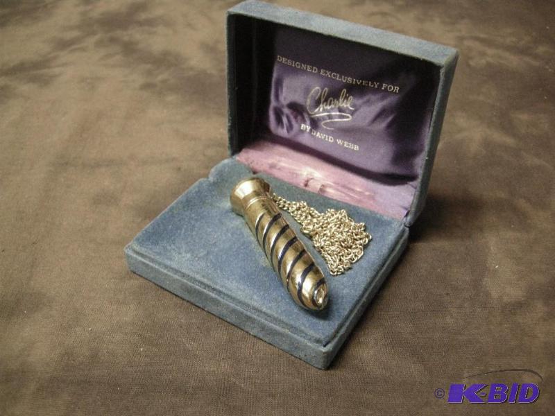 lot 138 image: Vintage Charlie perfume bottle necklace
