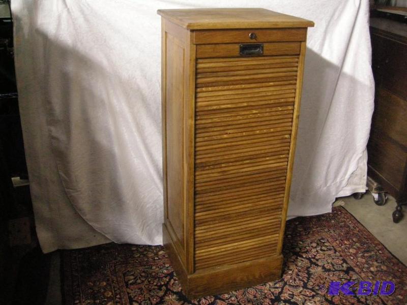 lot 21 image: Antique Bodmer & Bo Oak train station roll-front podiumcabinet