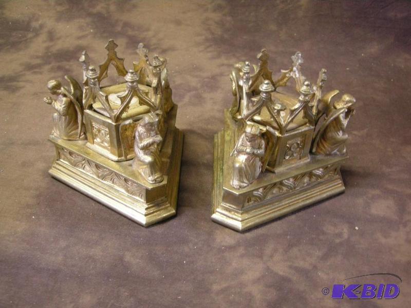 lot 365 image: Early cast bronze angel bookendscandle holders