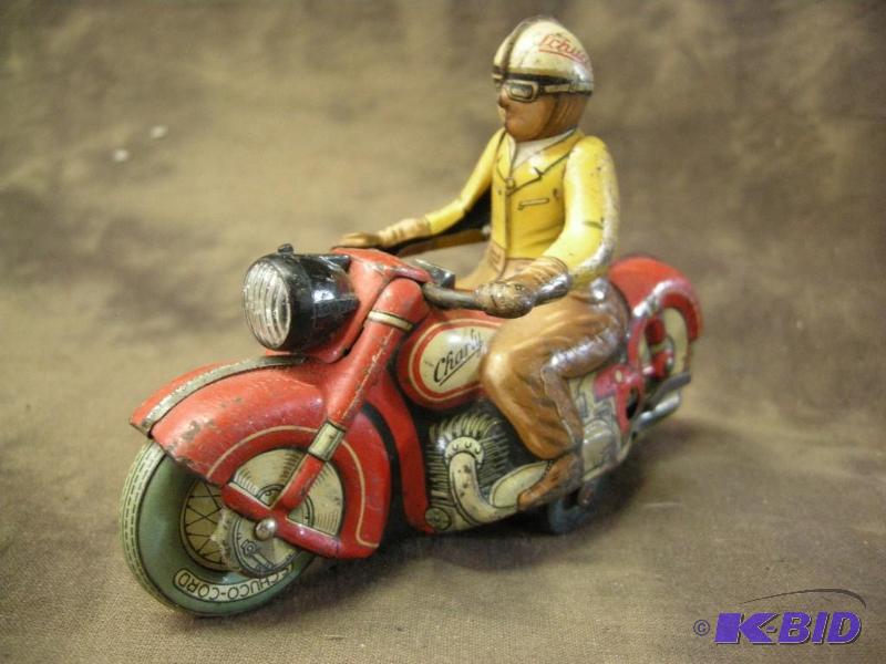 lot 388 image: Schuco Charly 1005 tin wind-up motorcycle guy